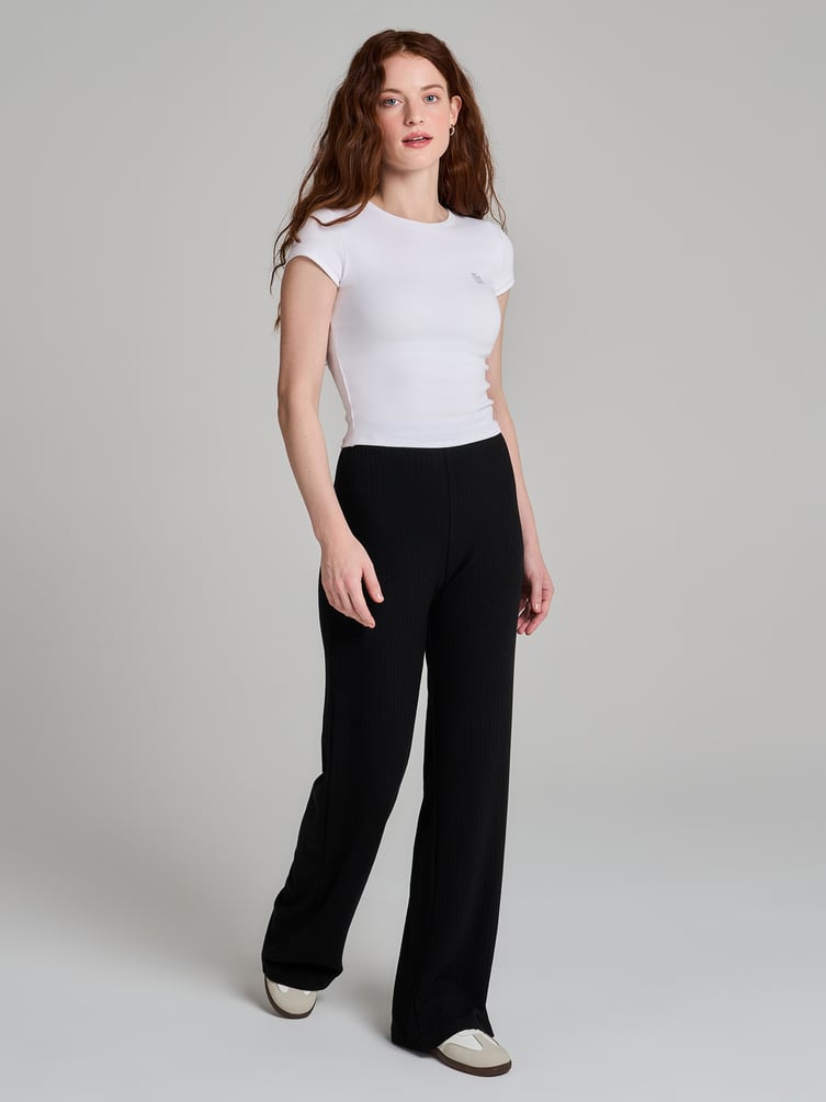 Брюки клеш от колена в рубчик