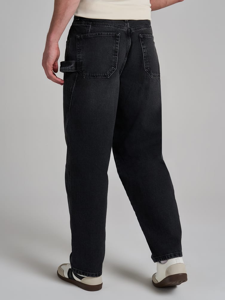 Джинсы багги зауженные с декоративной петлей