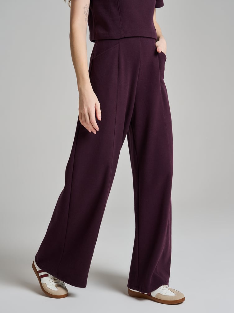 Широкие брюки в рубчик со стрелками