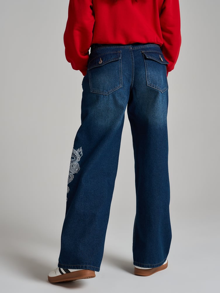 Джинсы багги с вышивкой дракона