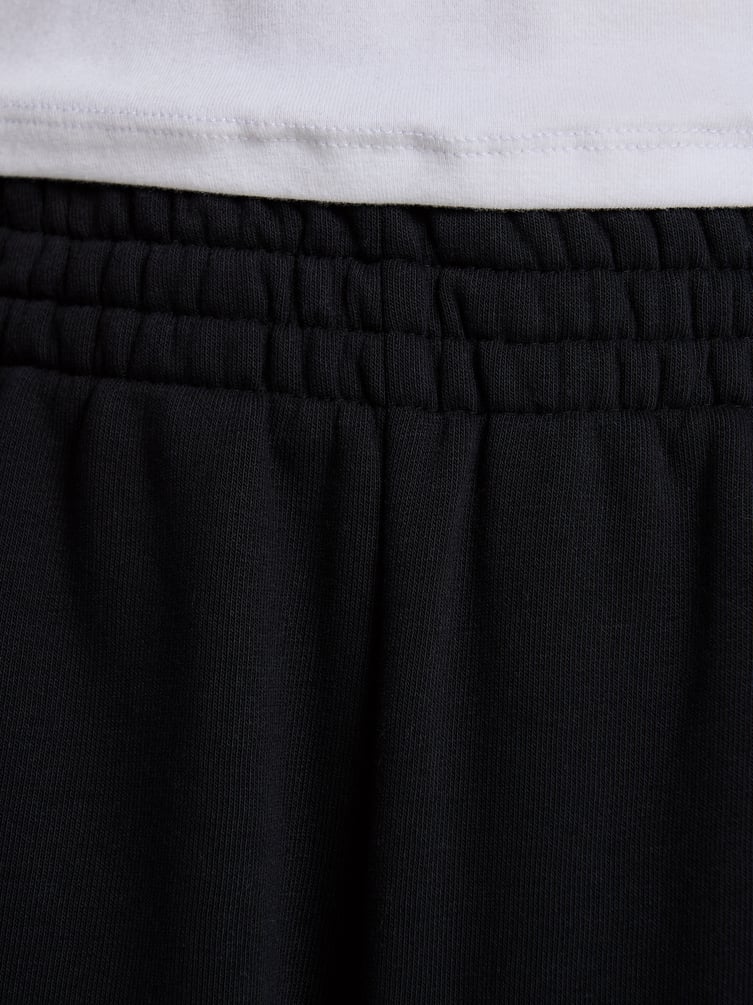 Брюки джоггеры с завязками по бокам