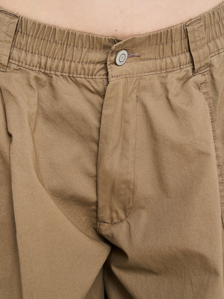 Брюки-бананы с защипами