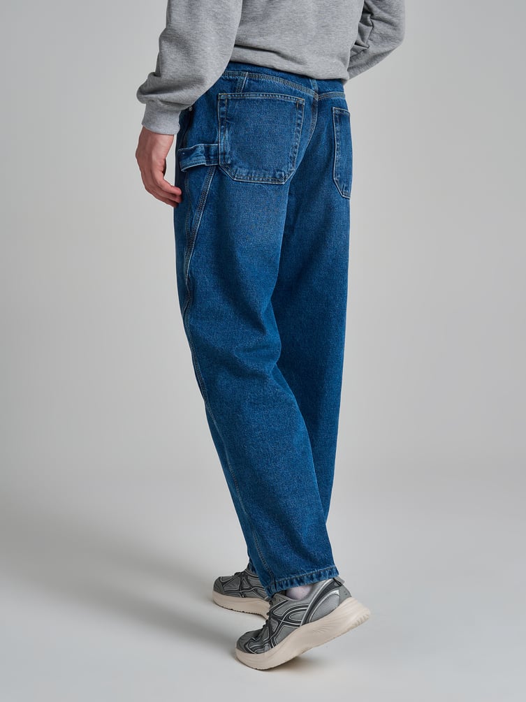 Джинсы багги зауженные с декоративной петлей