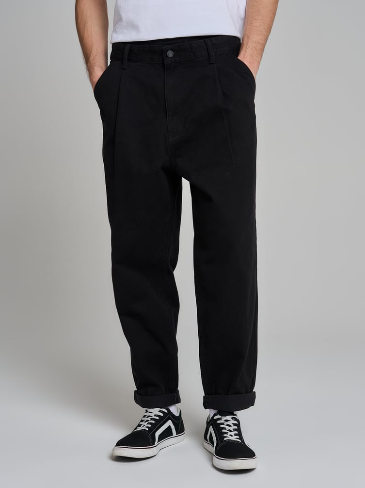 Зауженные широкие брюки