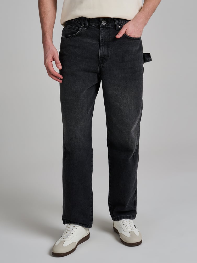 Джинсы багги зауженные с декоративной петлей