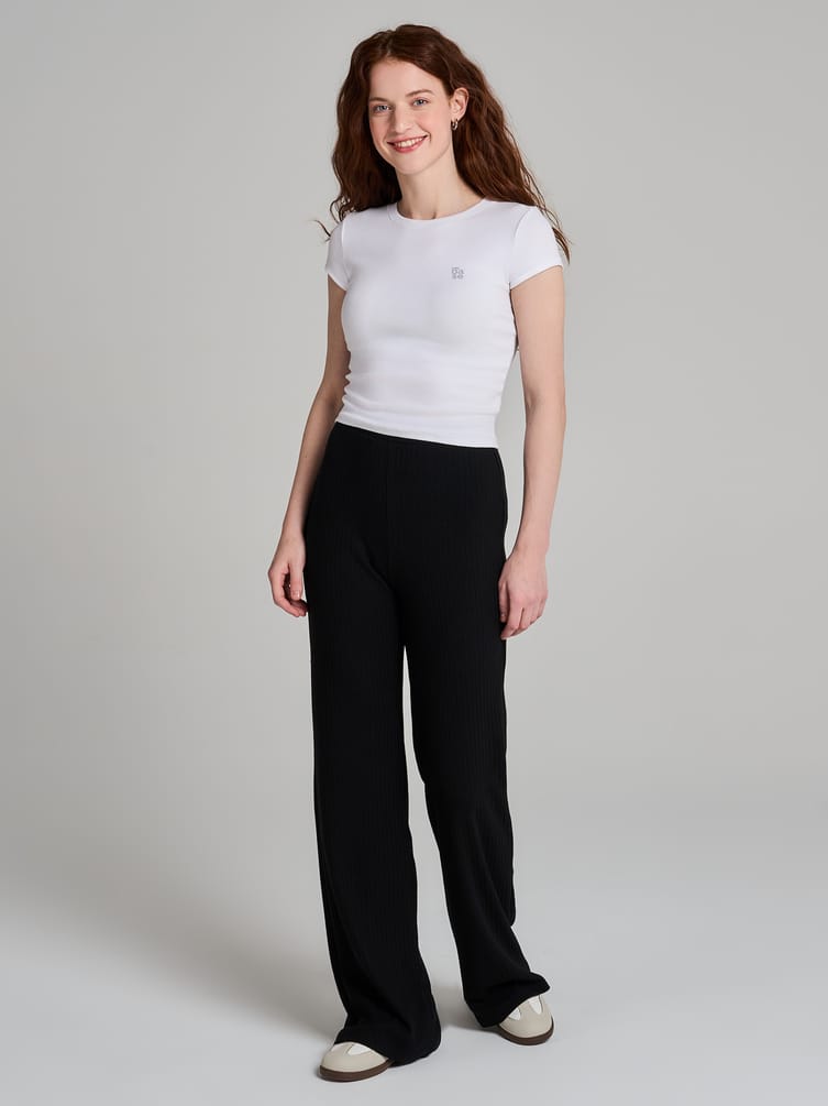 Брюки клеш от колена в рубчик