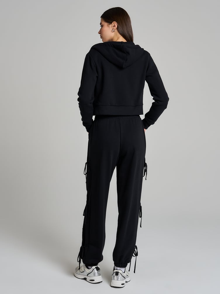 Брюки джоггеры с завязками по бокам