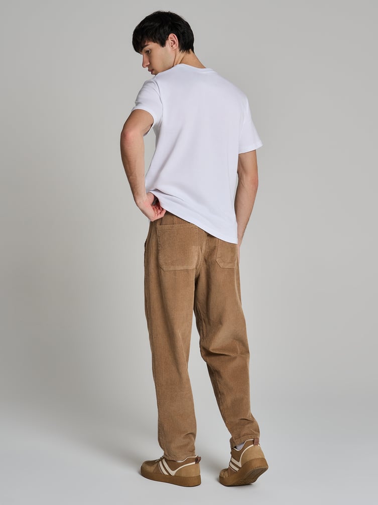 Вельветовые зауженные брюки