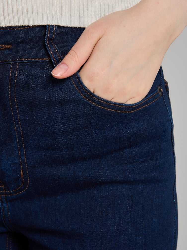 Джинсы клеш от колена