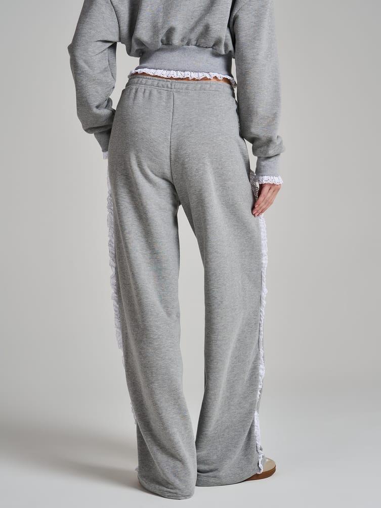 Широкие брюки с лампасами из кружева