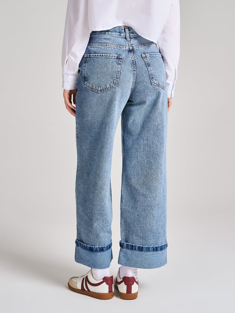 Джинсы широкие с подворотами