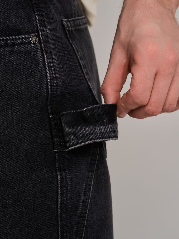 Джинсы багги зауженные с декоративной петлей