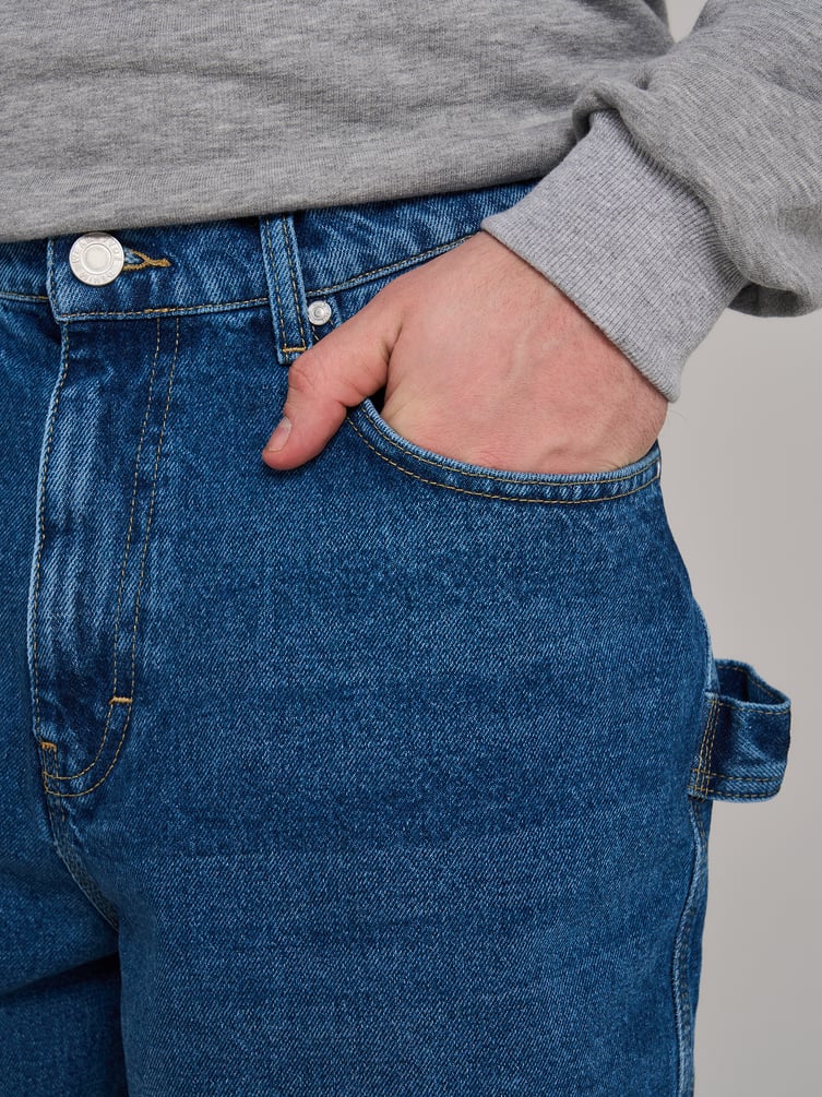 Джинсы багги зауженные с декоративной петлей