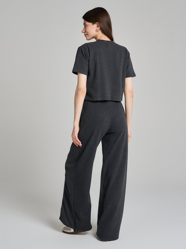 Широкие брюки в рубчик со стрелками