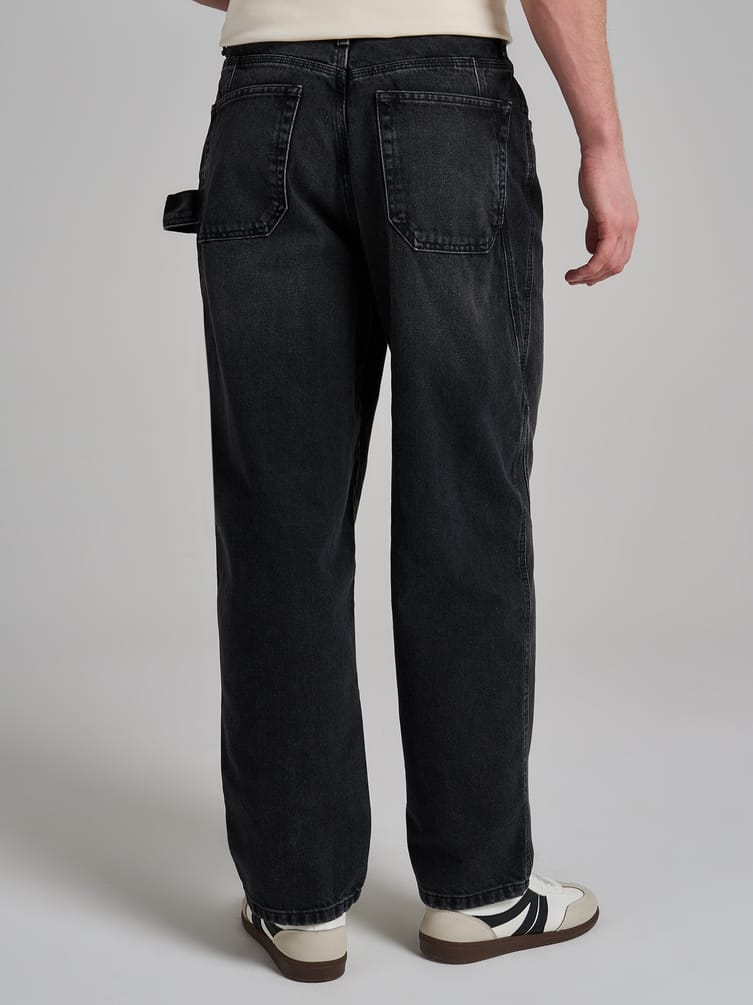 Джинсы багги зауженные с декоративной петлей