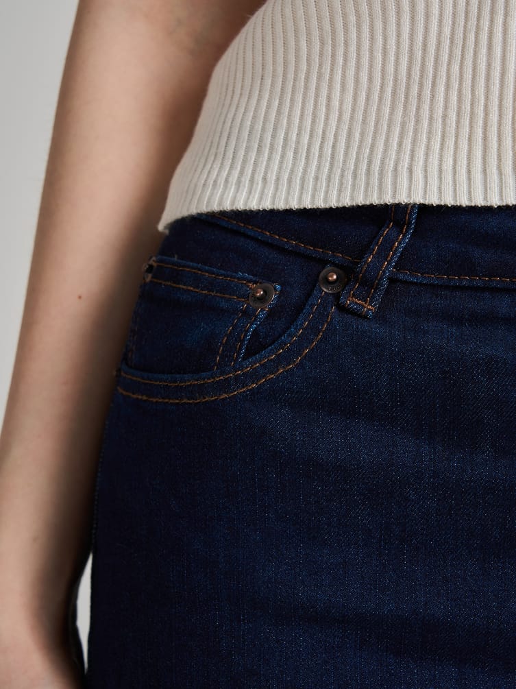 Джинсы клеш от колена