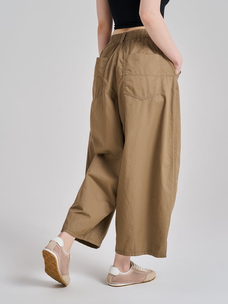 Брюки-бананы с защипами