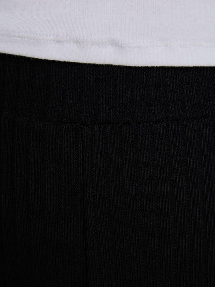 Брюки клеш от колена в рубчик