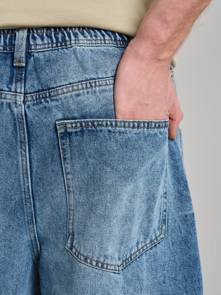 Джинсы багги с вареным эффектом