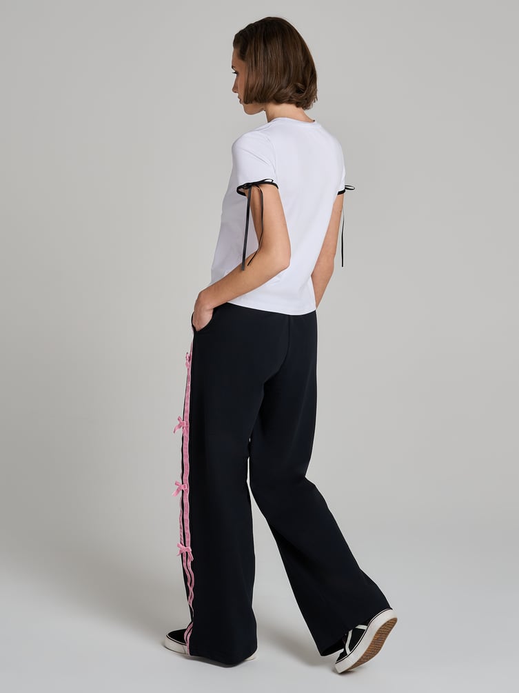 Повседневные брюки оверсайз с лампасами и бантиками