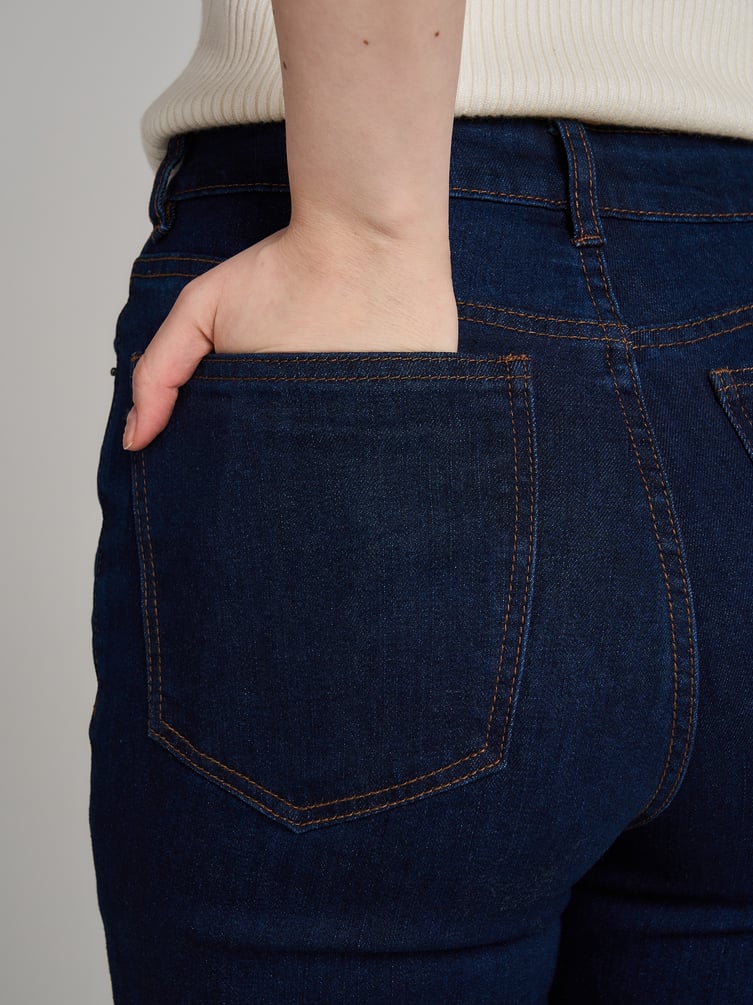 Джинсы клеш от колена