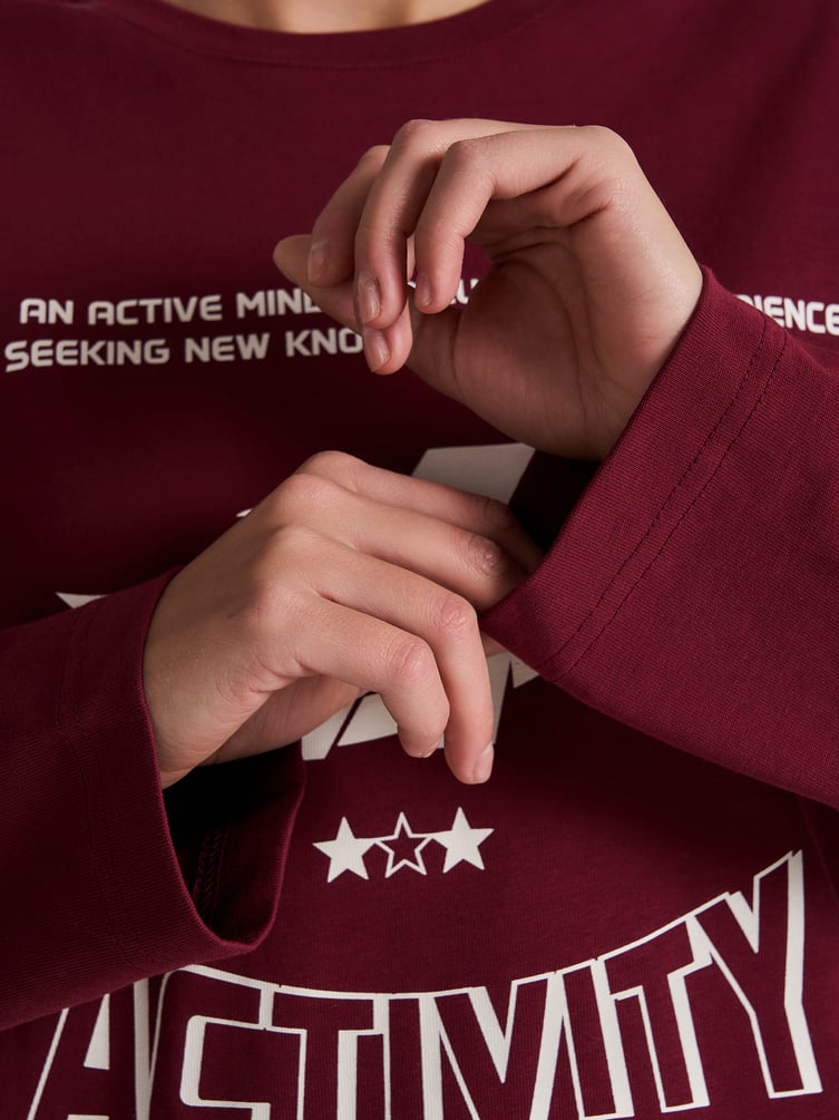 Лонгслив оверсайз с надписью на спине