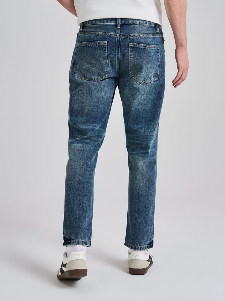 Джинсы прямые укороченные с разрезами