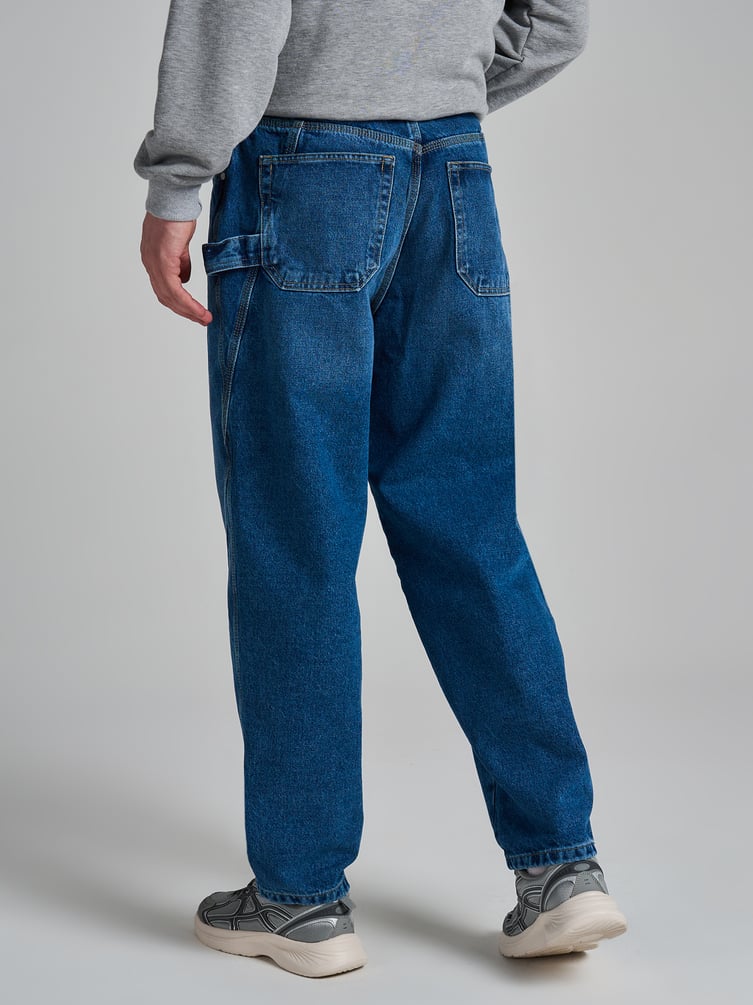 Джинсы багги зауженные с декоративной петлей