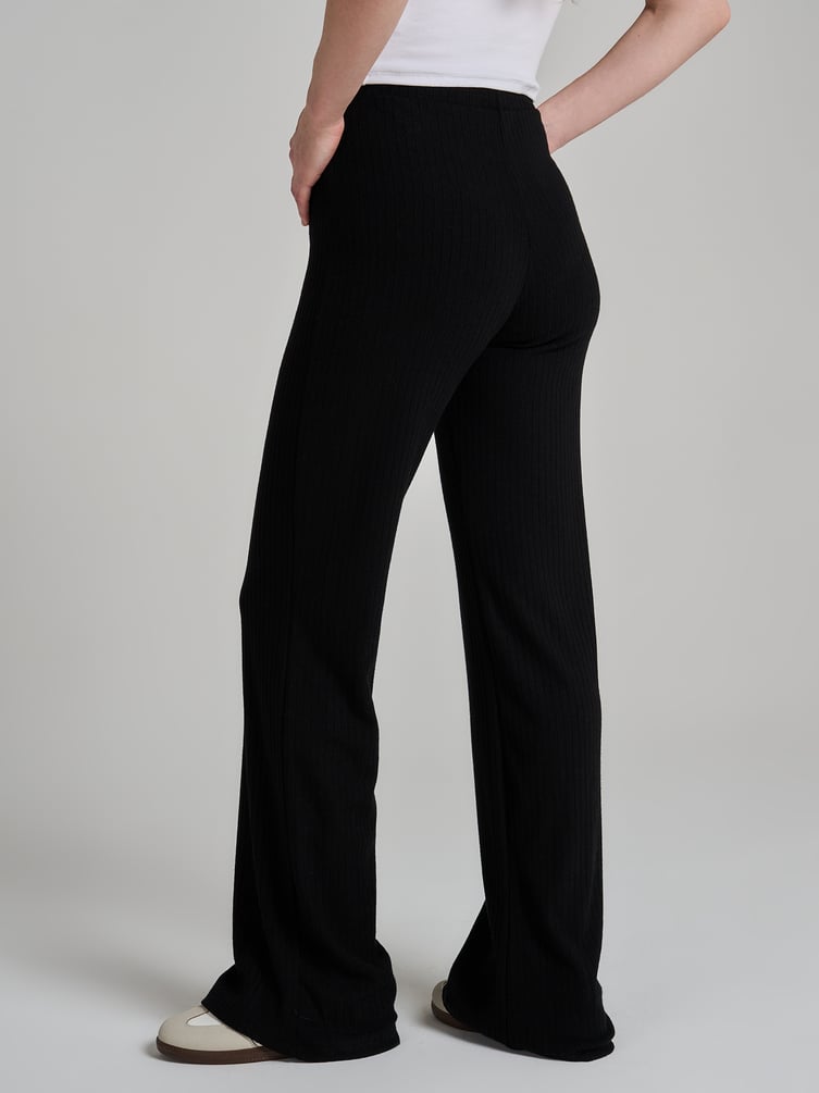 Брюки клеш от колена в рубчик