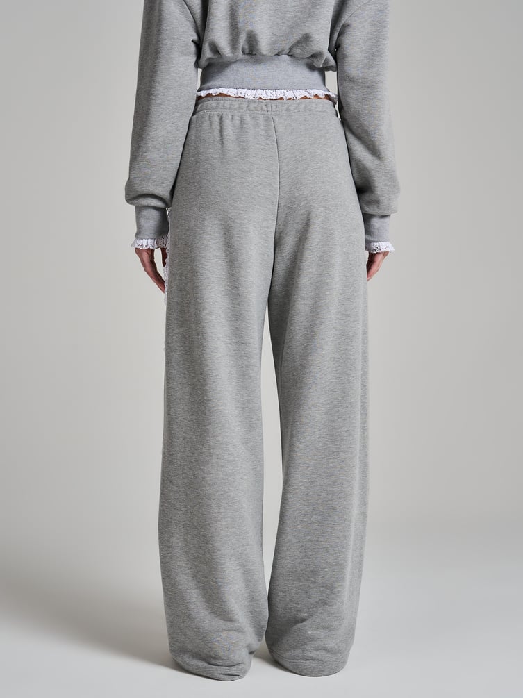 Широкие брюки с лампасами из кружева