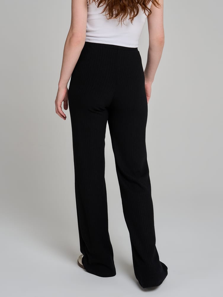 Брюки клеш от колена в рубчик