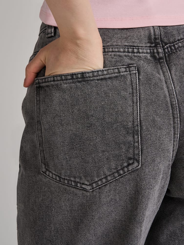 Джинсы широкие с асимметричной застежкой