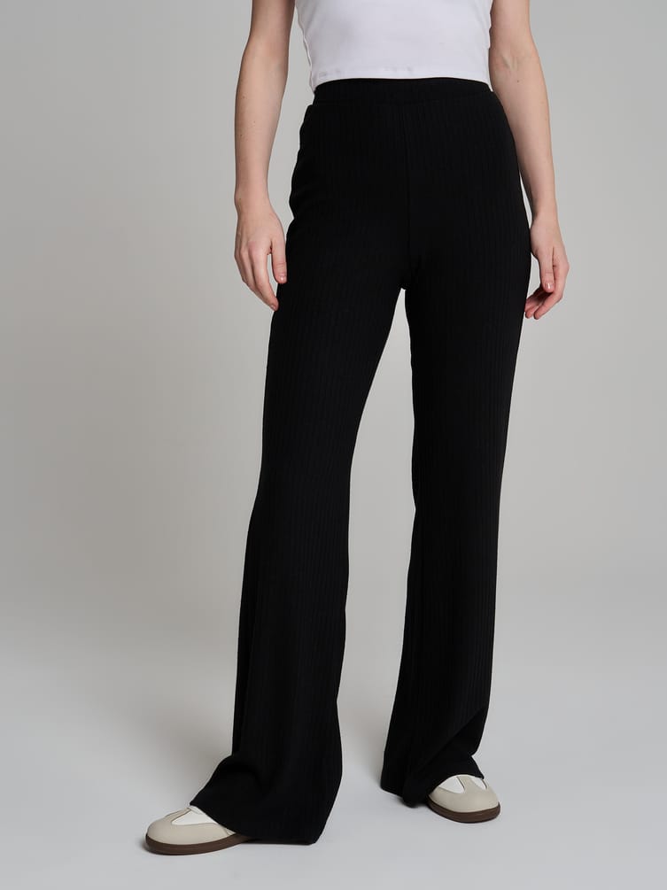 Брюки клеш от колена в рубчик